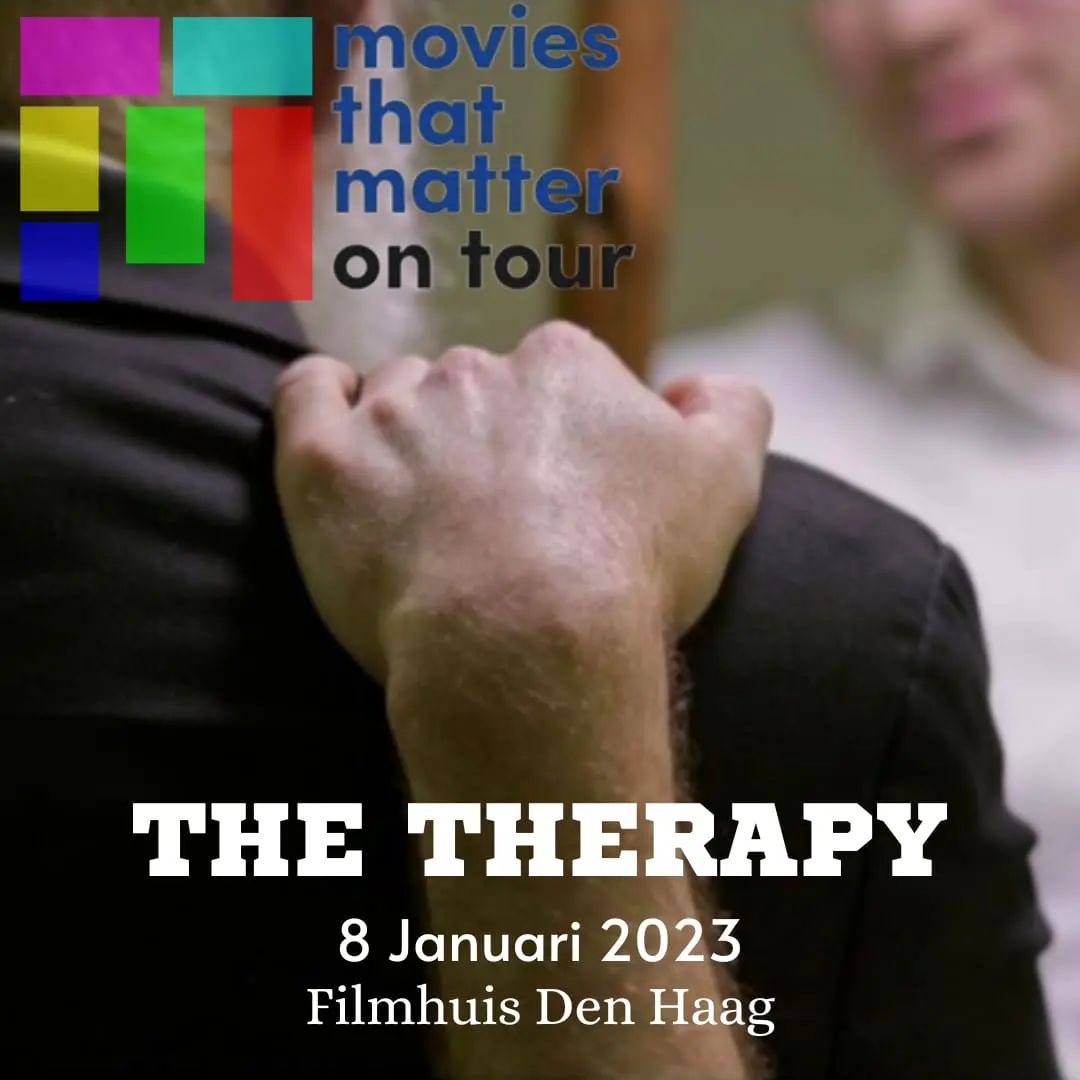 Online filmposter flyer with the text "Movies That Matter On Tour - The Therapy - 8 Januari 2023 Filmhuis Den Haag" on it. A white man's hand lays on the shoulder of another man, who wears a long grey beard and a black suit.